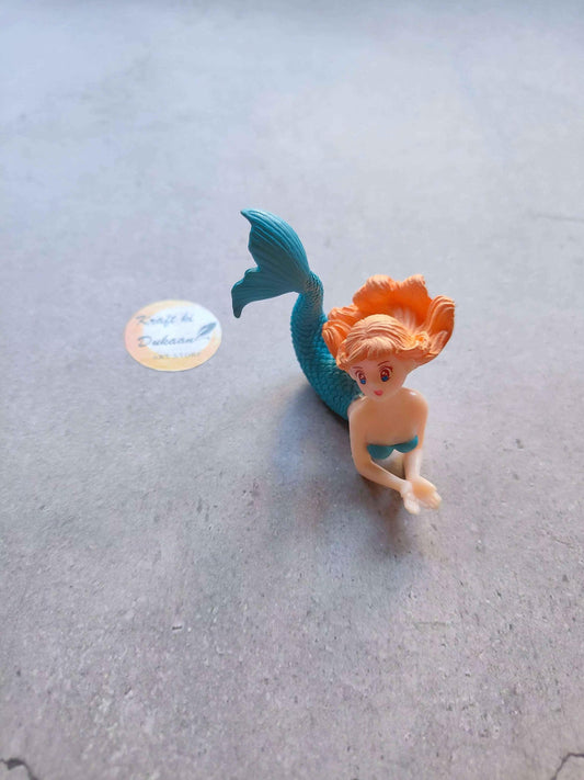 Single mermaid mini figurine with blue tail and orange hair, sitting pose
