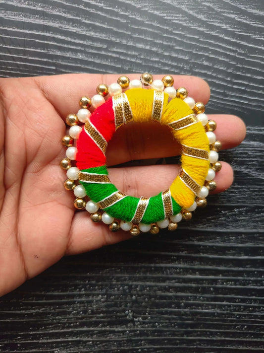 Round gota ring in hand: multicolor striped fabric with pearl and gold bead edge