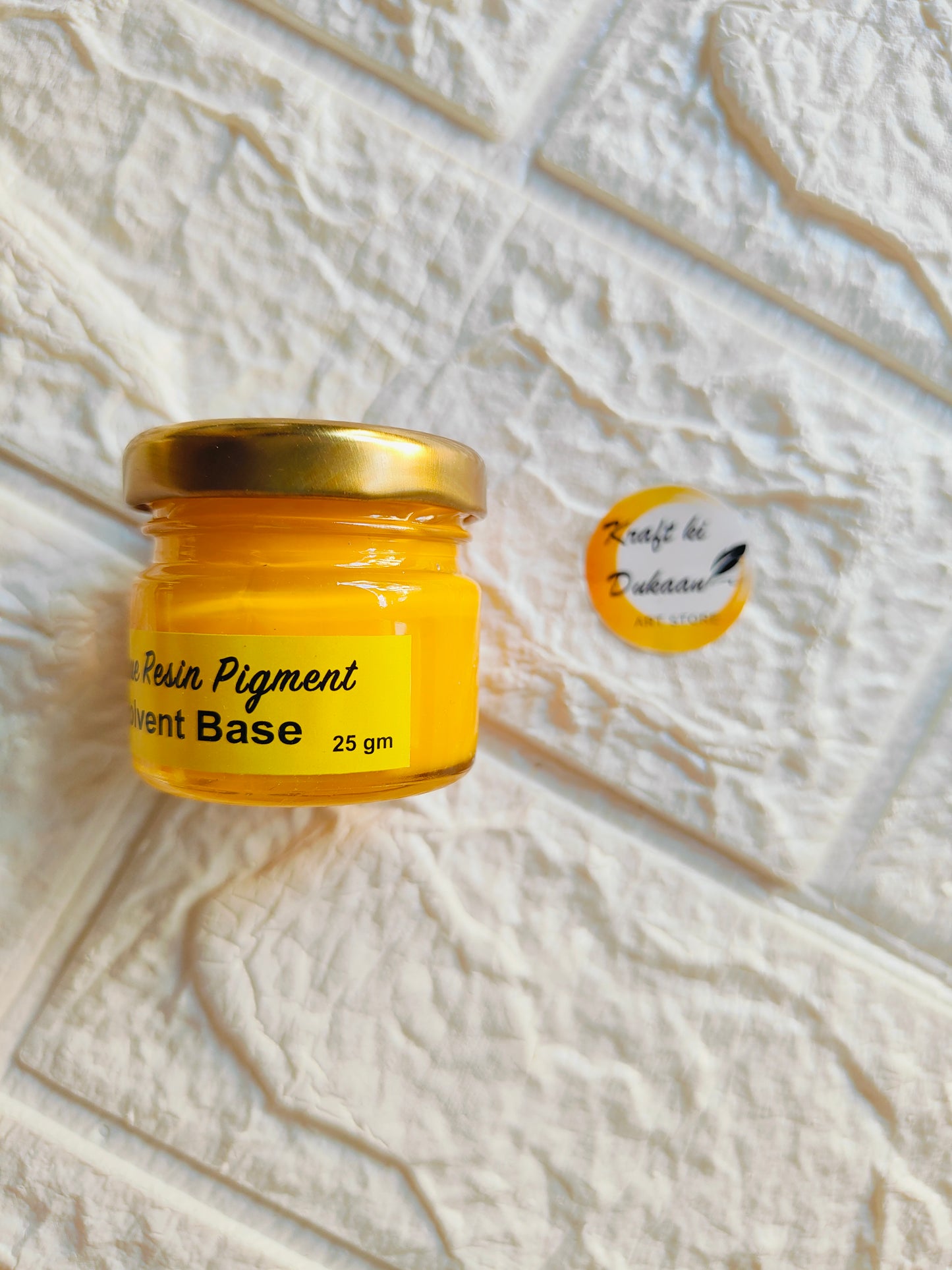 Kraft ki Dukaan opaque pigment for resin in a yellow jar, 25 gm capacity, perfect for crafting projects