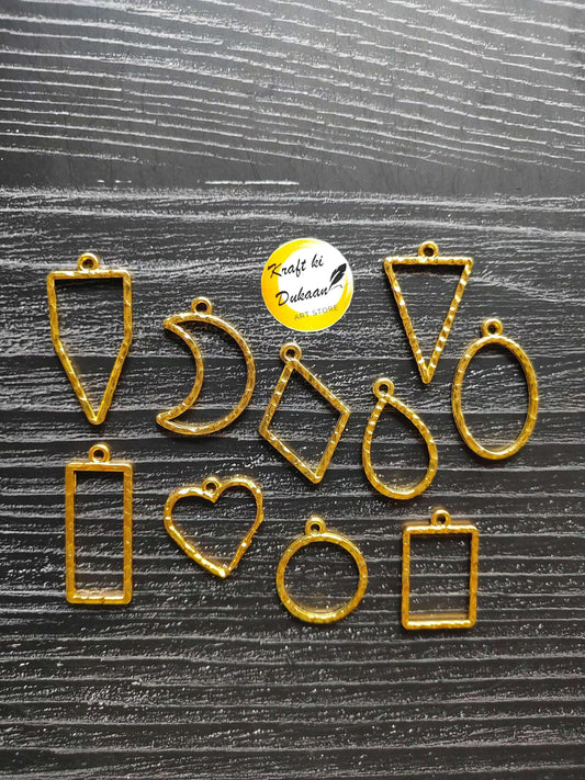 Gold-tone bezel pendants set: shield, moon, diamond, oval, rectangle, heart