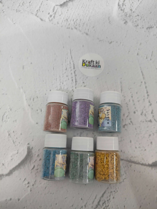 Rubber particles pack of 6: six bottles showing teal, purple, blue, green, yellow shades