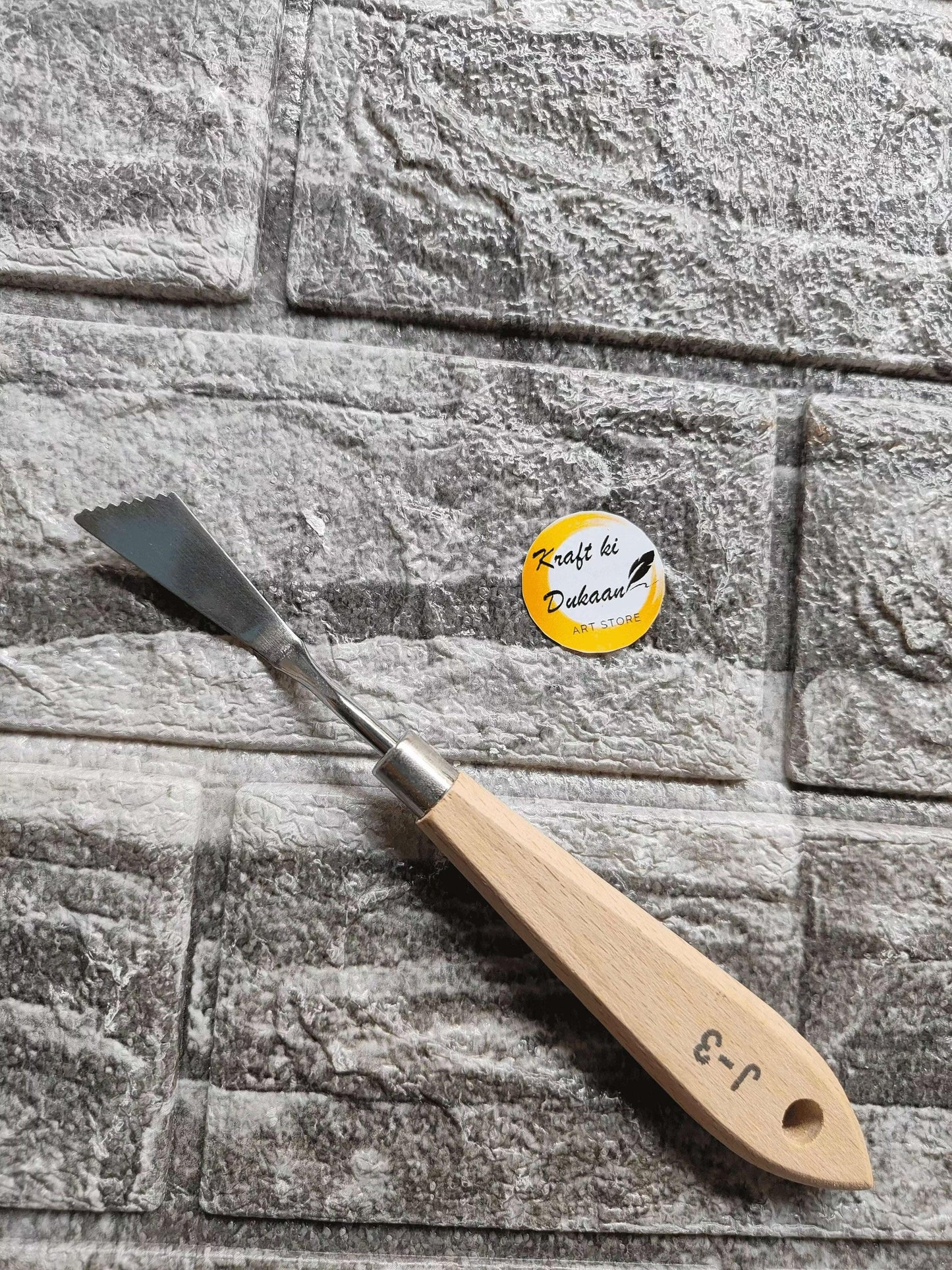 Painting knife A7 with wooden handle and angled metal blade