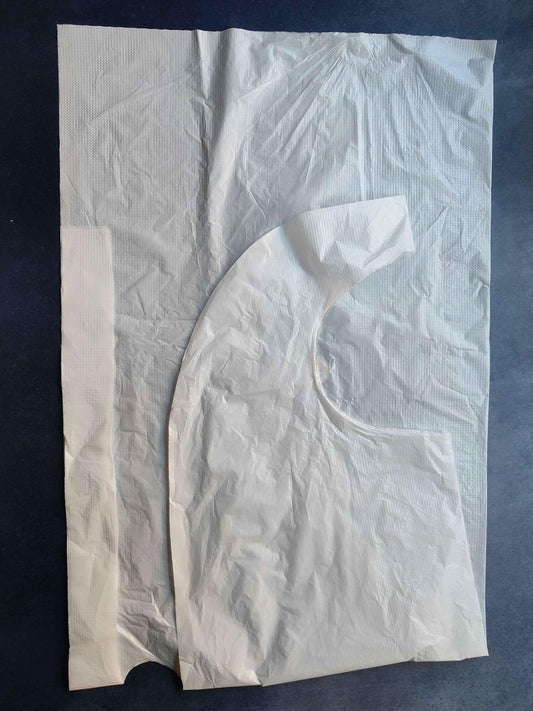 White plastic art apron with large curved front pocket area and side ties