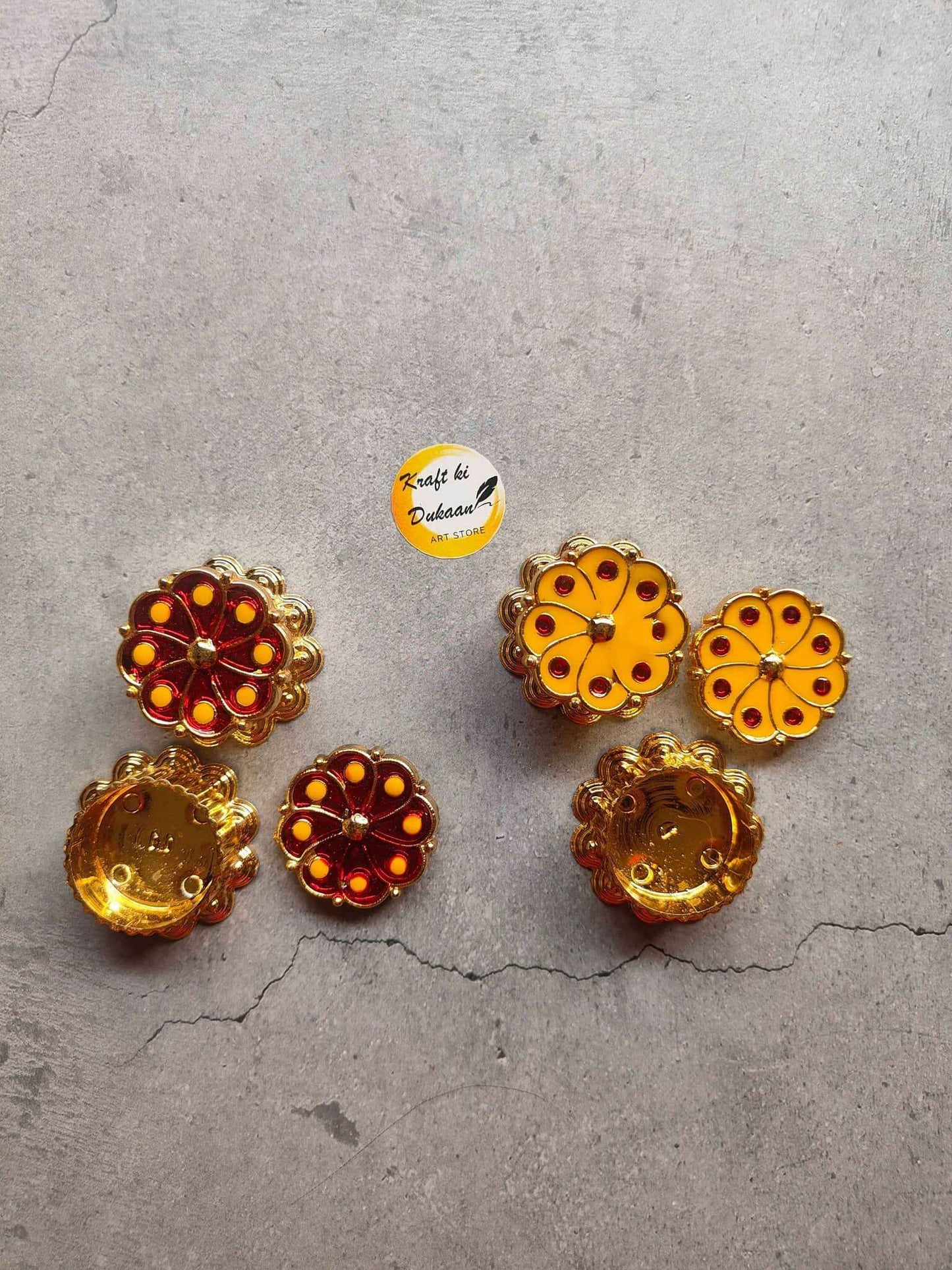 Handmade circular rosette embellishments with red and yellow stones