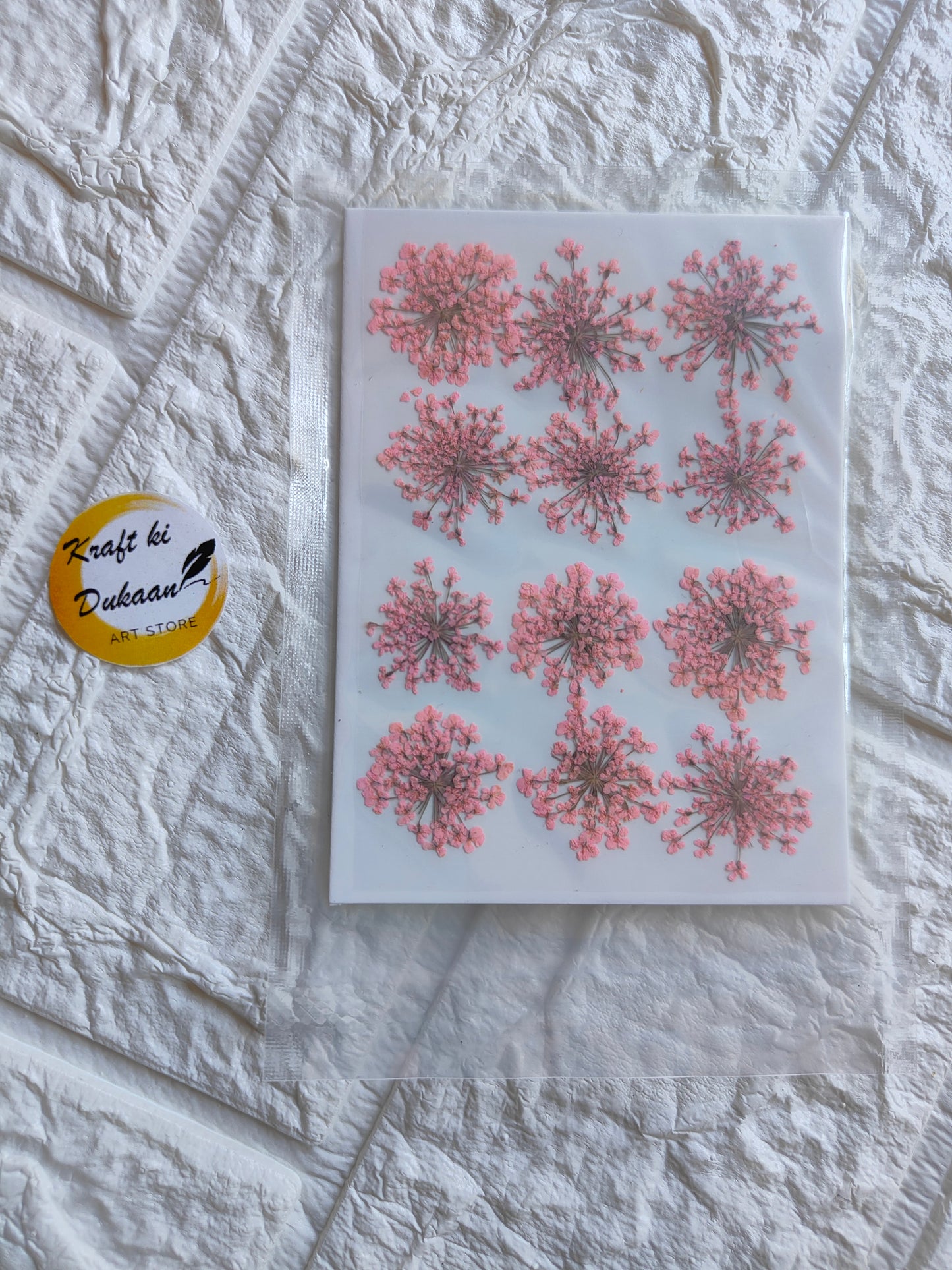 Pressed flower art supplies in pink floral designs for crafting and decoration