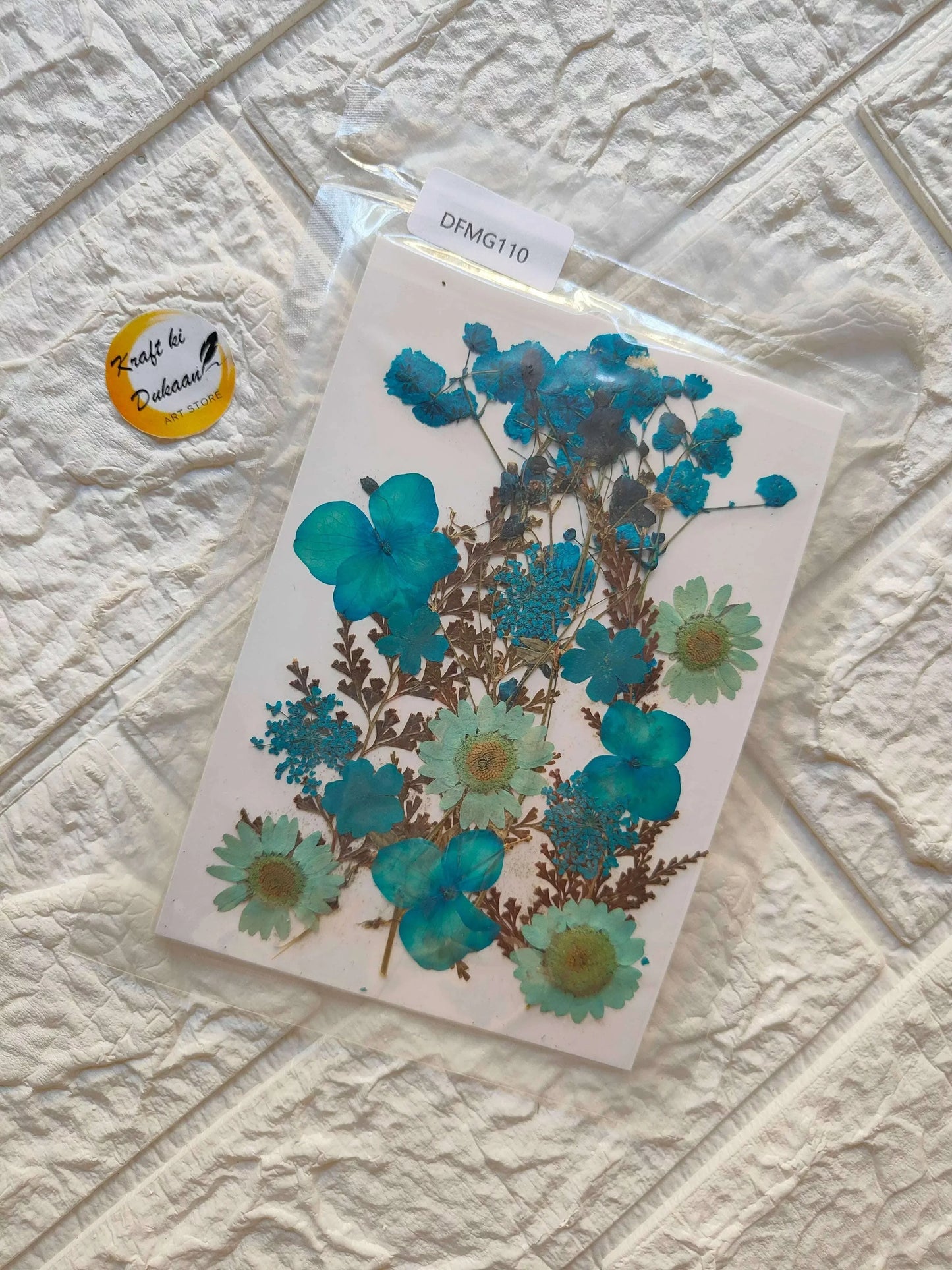 Pressed Flower Sheet Mix B27 with teal and blue blooms on a clear backing