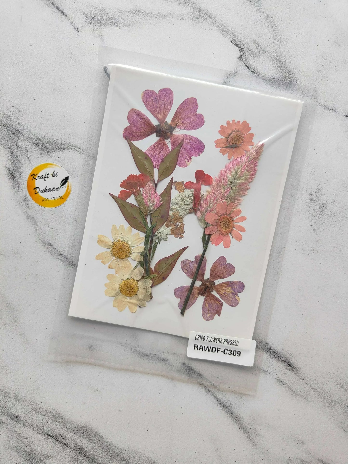 Pressed flower sheet mix F5 with pink, red and yellow dried blossoms on white sheet
