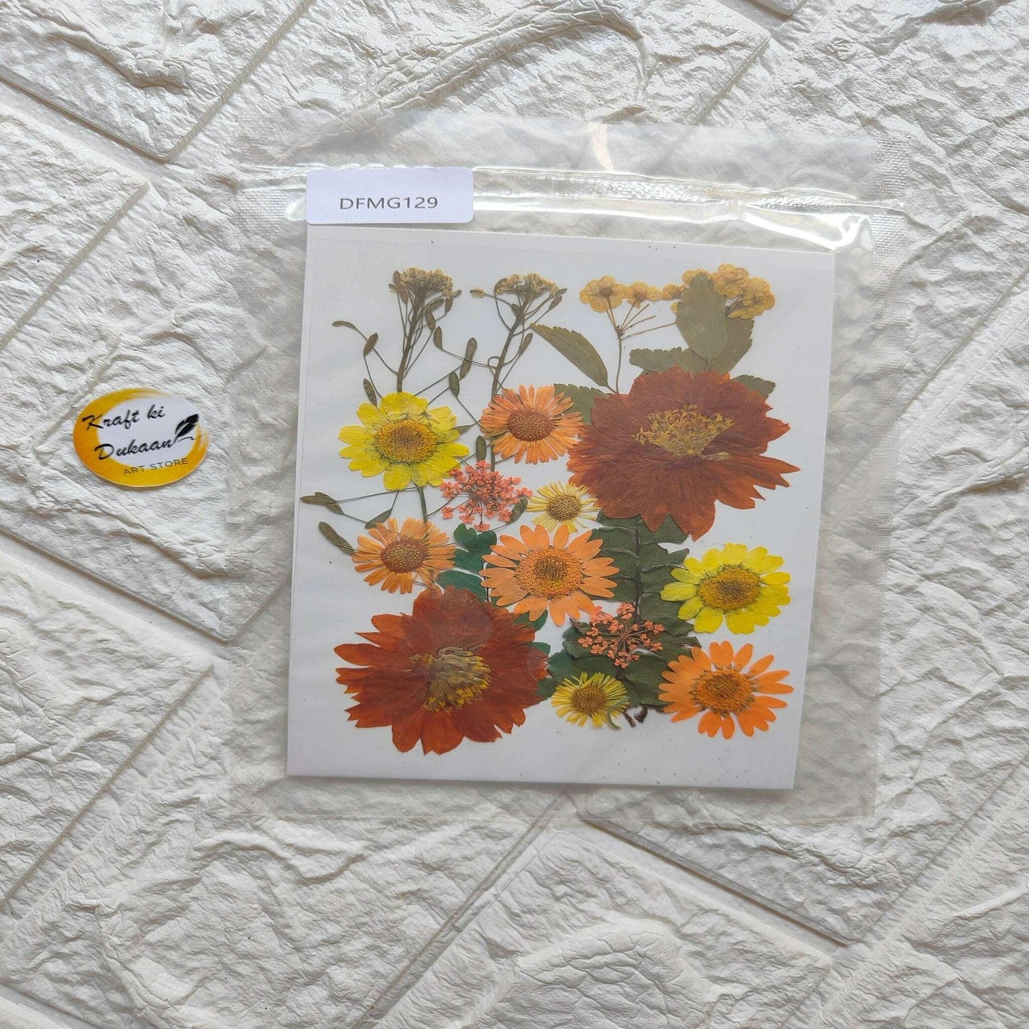 Pressed flower sheet mix with orange, yellow and red blooms in a clear packet