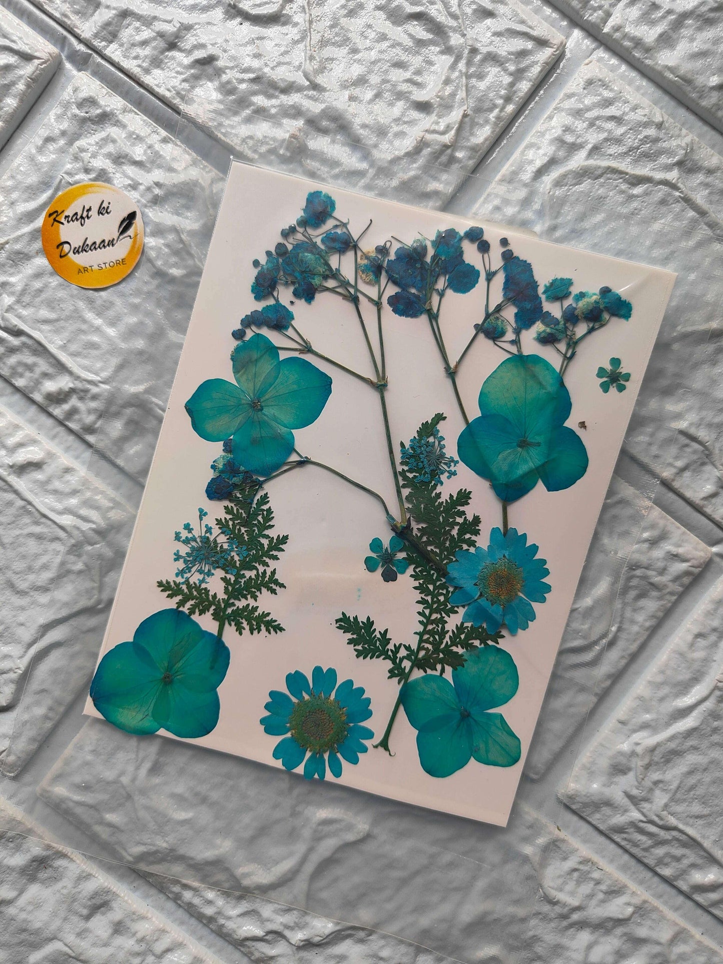 Pressed Flower Sheet Mix A4 with teal and blue pressed flowers on a white sheet