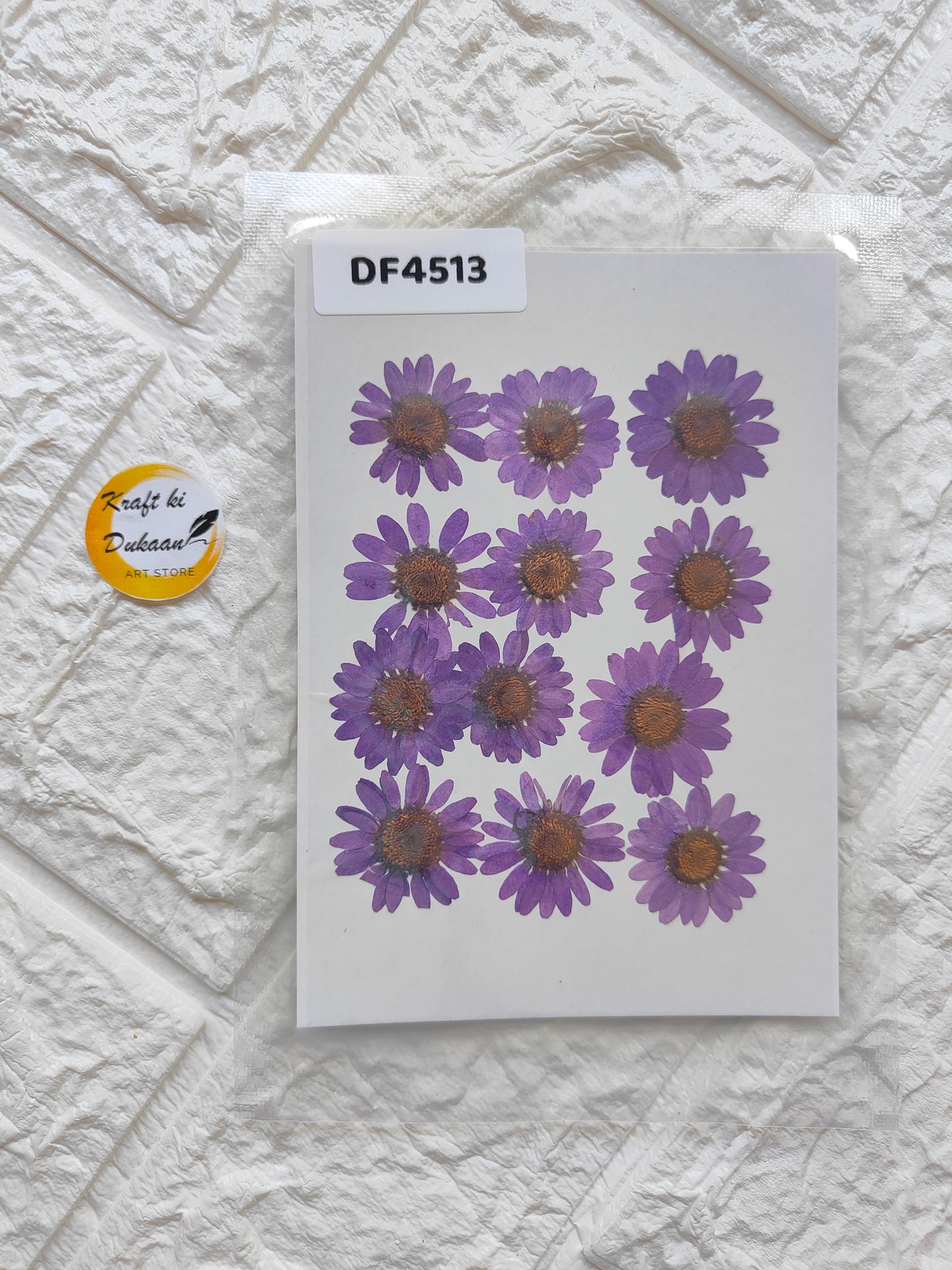 Pressed real daisy flower sheets in vibrant purple, perfect for crafts and decor projects