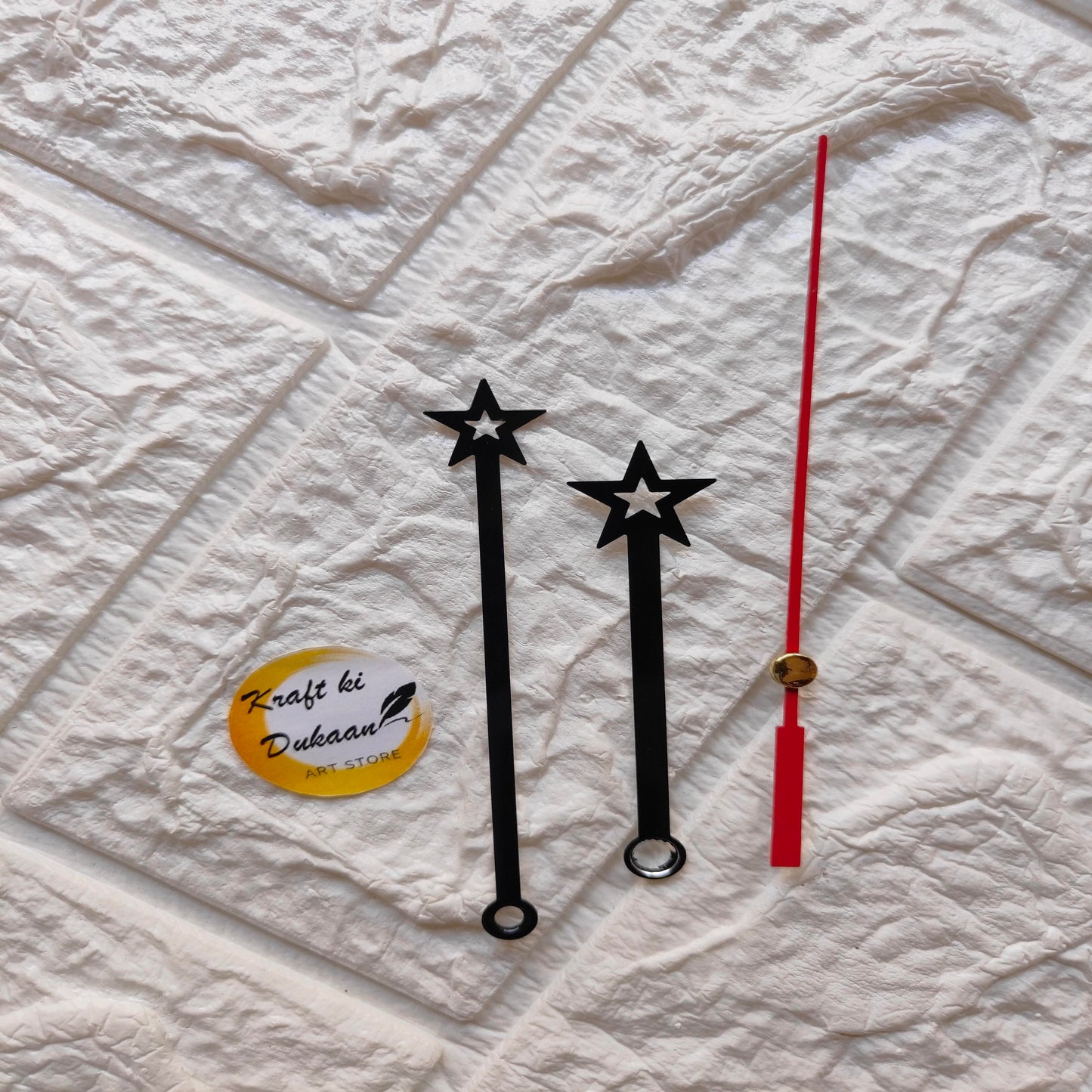Set of red and black clock hands with star designs for DIY clock projects