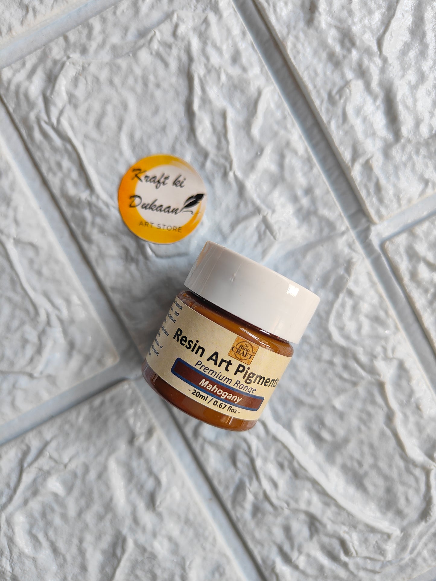 Kraft ki Dukaan Opaque Pigment for Resin Art in Brown Jar with Label on Textured Background