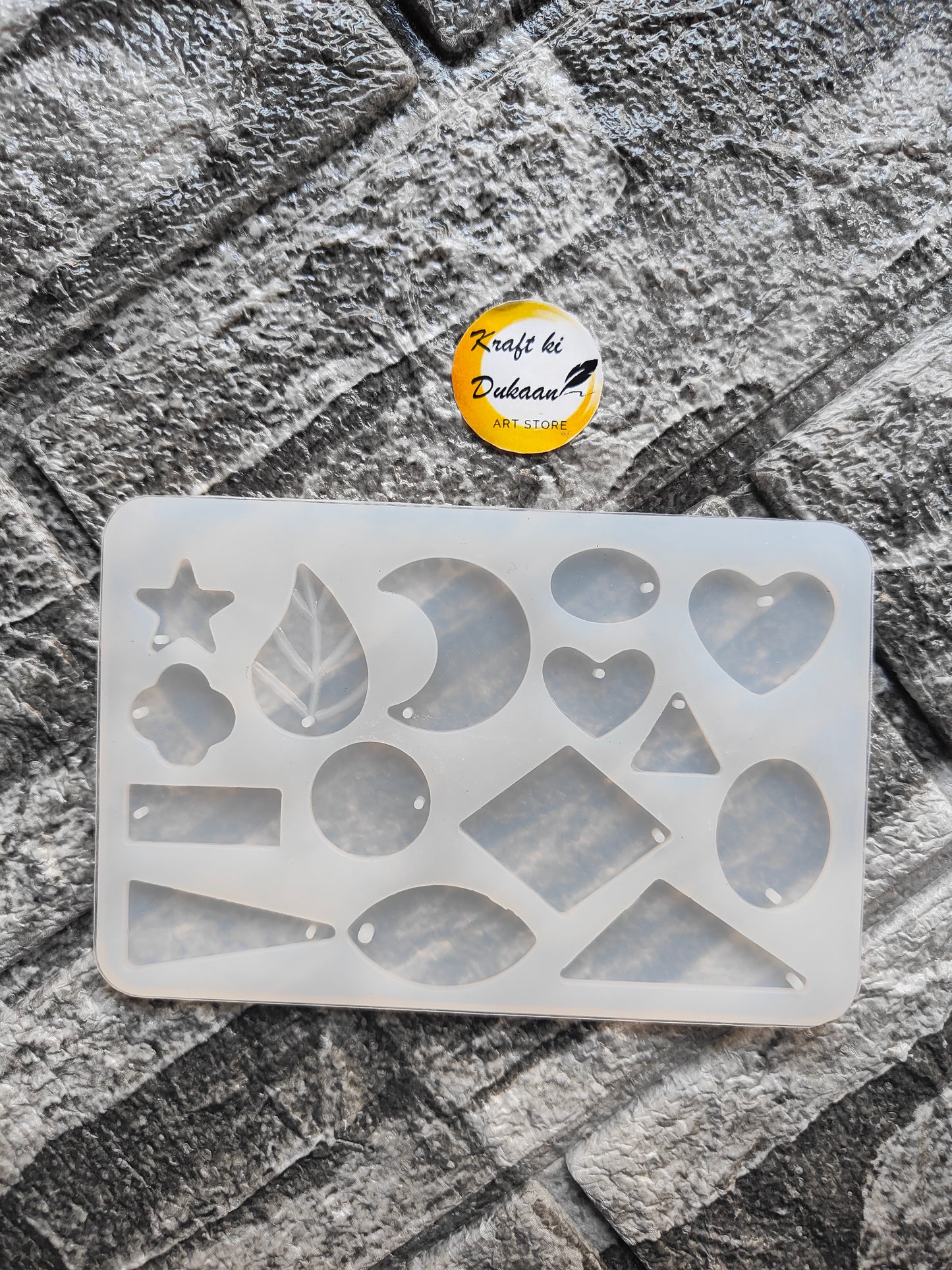 Flexible silicone resin jewellery mould featuring various shapes including hearts, stars, and leaves
