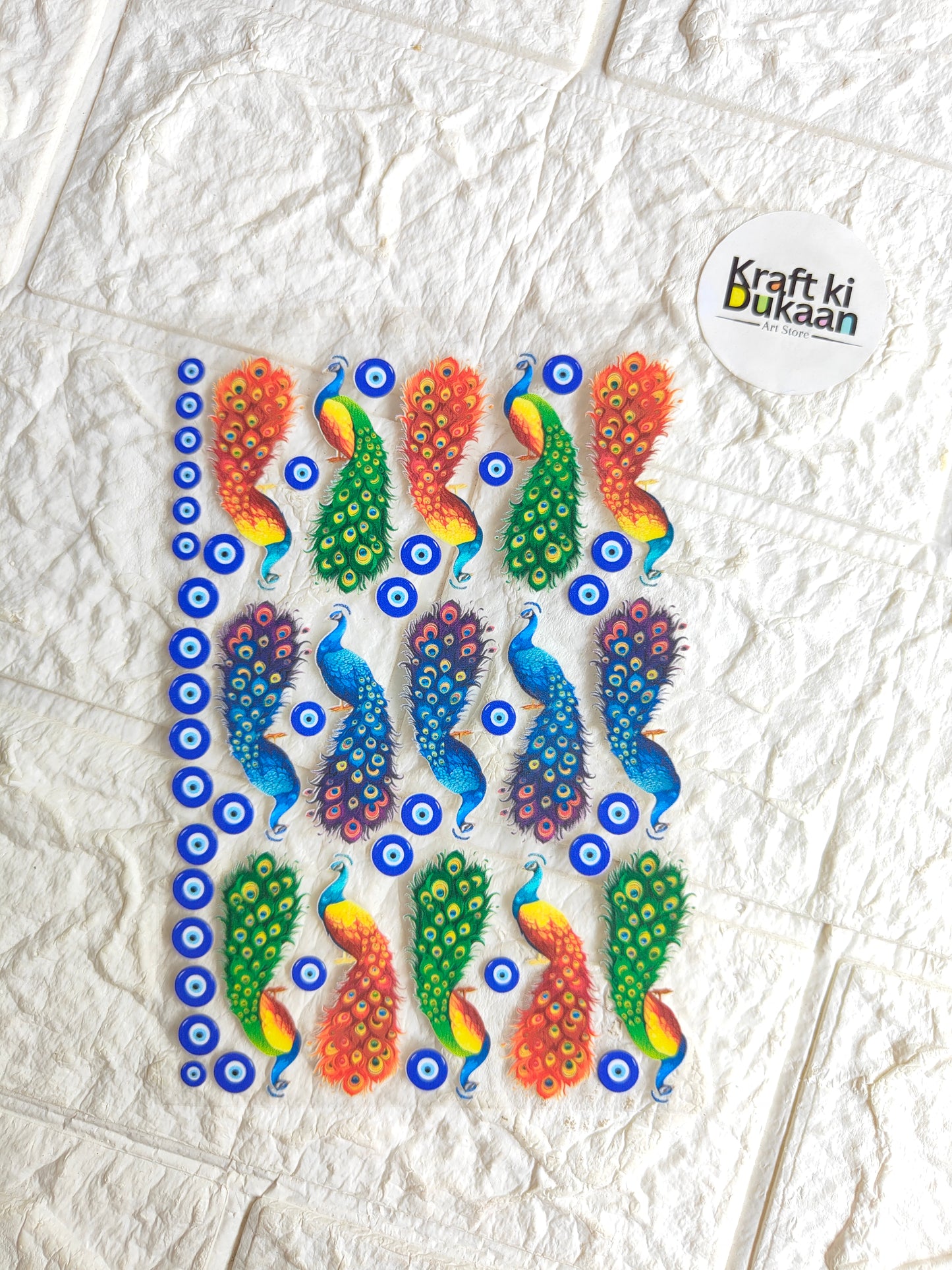 UV DTF peel-off sticker sheet with colorful fish and eye-circle pattern, Kraft ki Dukaan logo