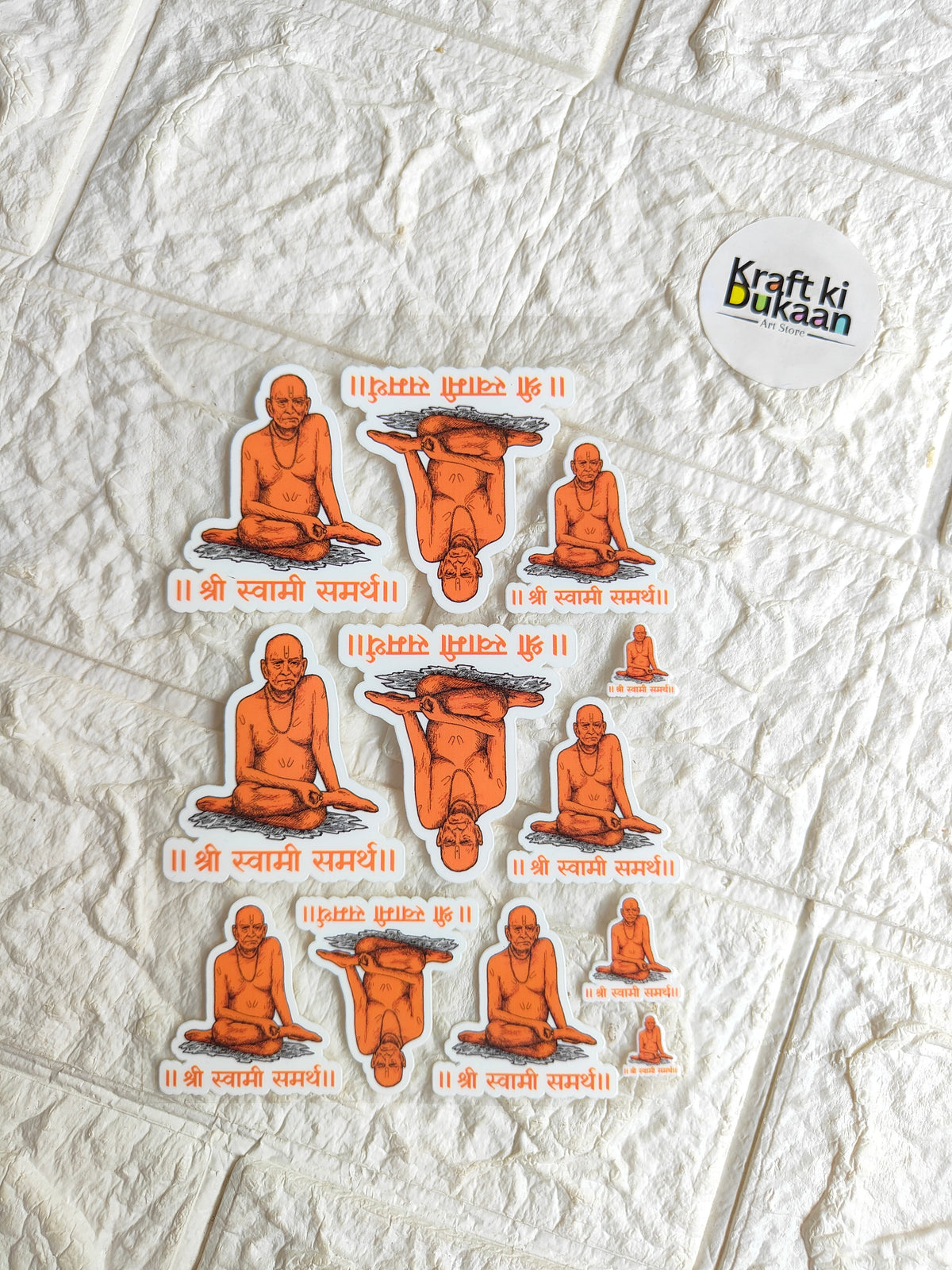Peel-off sticker sheet with multiple orange figure decals and small text labels