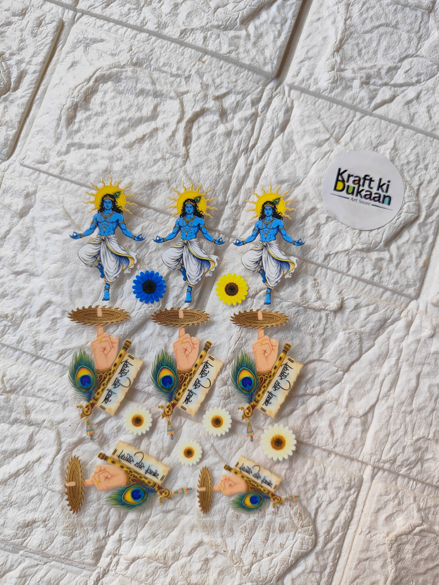 Peel-off sticker sheet with blue deity figures and peacock feathers, with sunflower accents