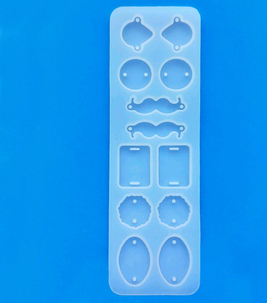 12-cavity rakhi mould, clear rectangular silicone tray with 12 decorative outlines