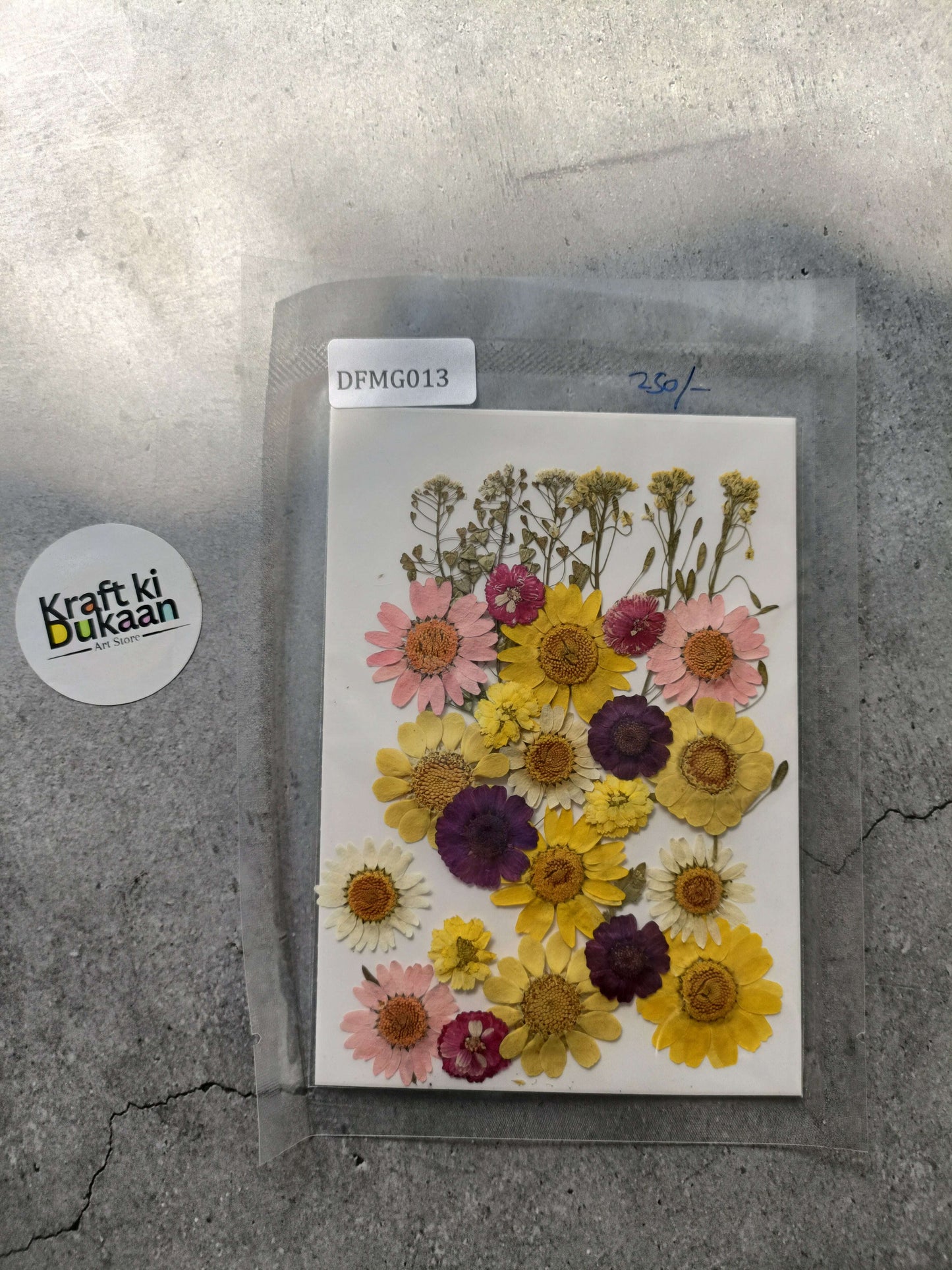 Pressed flower sheet mix with assorted pink, yellow, and purple dried blooms