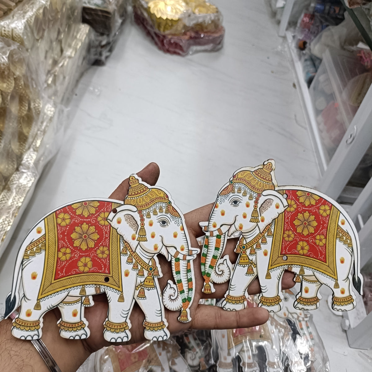 Decorative MDF elephant cutout pair with colorful red and gold detail