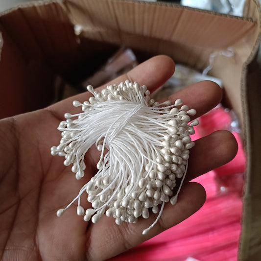 Artificial pollen bunch, white bead-like tips on thin white filament stems