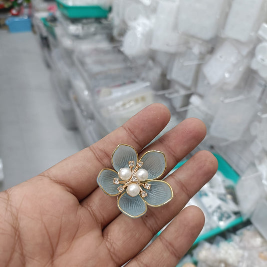 Acrylic petal pearl flower in light blue with pearl and rhinestone center on gold edging