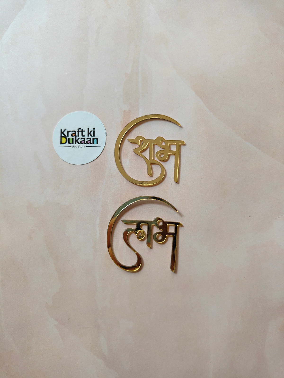 Gold acrylic Shubh Labh cutout pair with decorative Hindi lettering