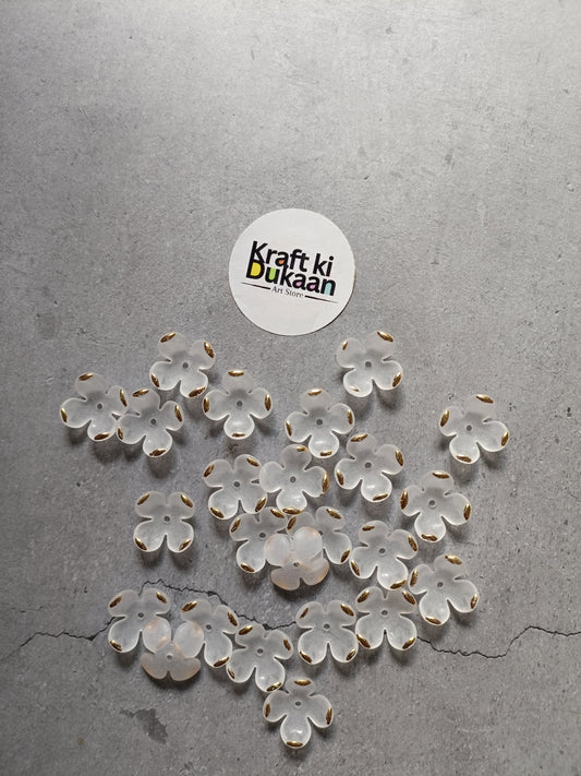 White flower beads, scattered display of petal-shaped beads; pack of 50