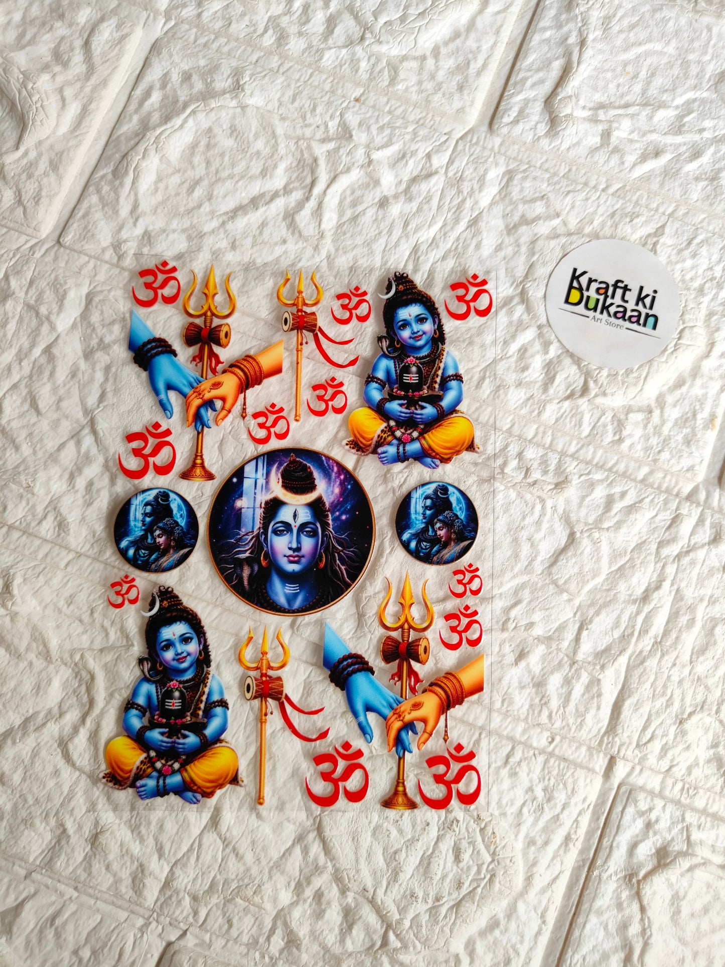 Peel-off sticker sheet with blue Krishna figures and red Om symbols, UV DTF designs