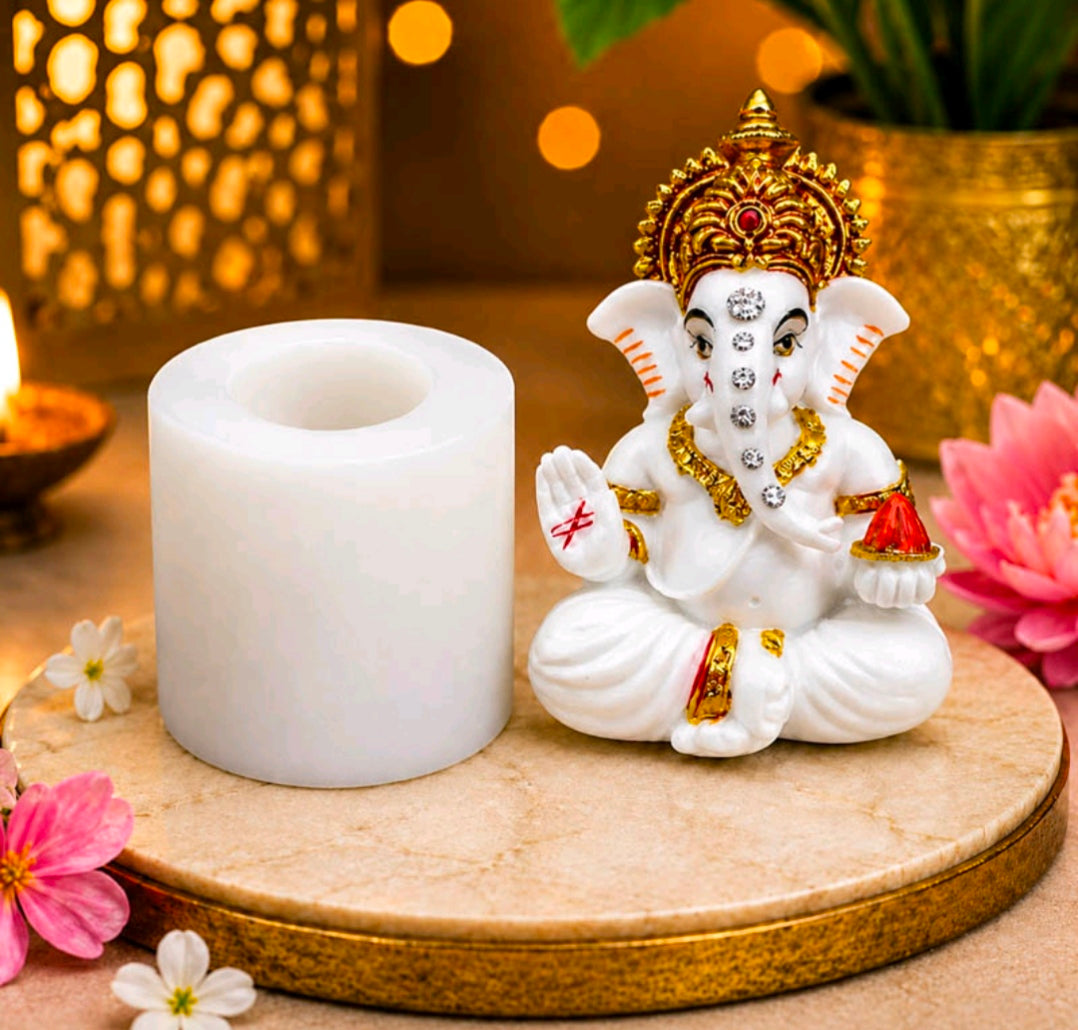 White silicone mould with round cylindrical cavity, Ganesh-themed shape