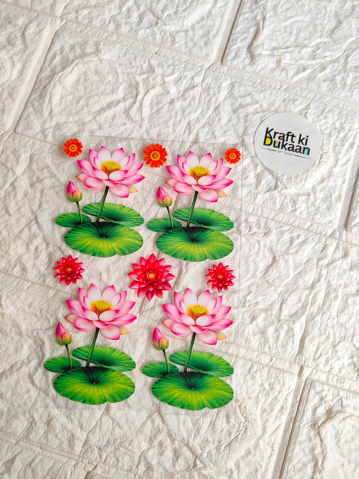 UV DTF peel-off sticker sheet with pink lotus flowers, green leaves, and small red blooms