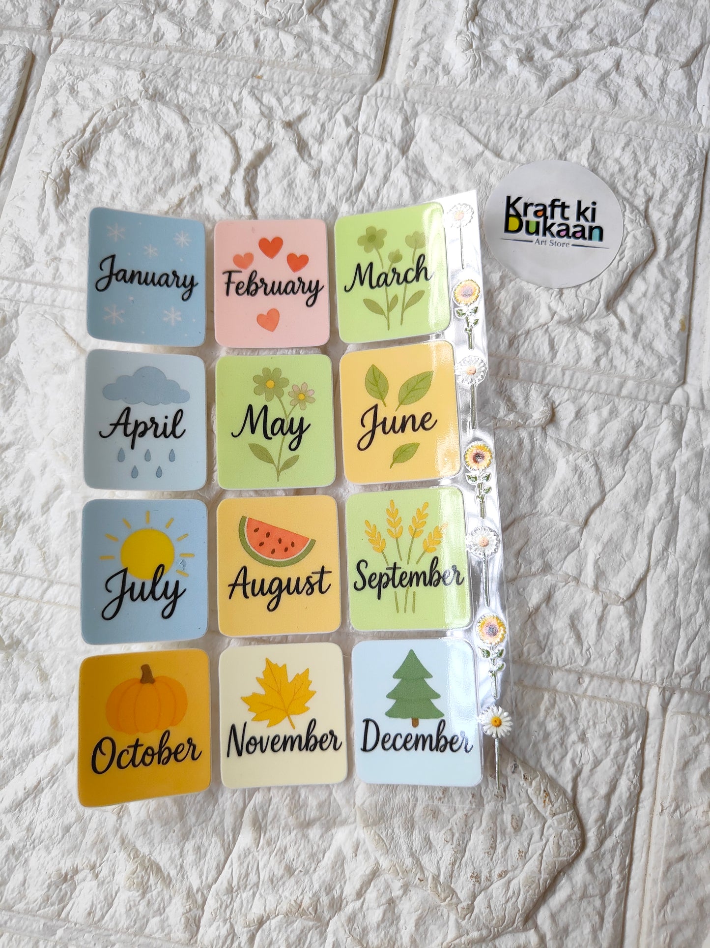 Peel-off sticker sheet with 12 calendar month labels, includes Craft ki Duka logo