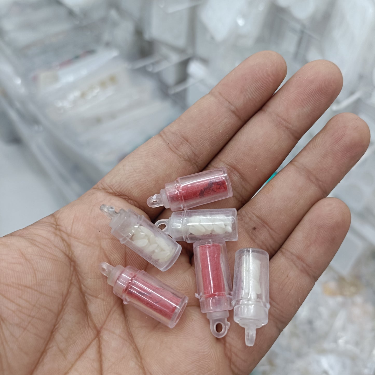 Small translucent squeeze bottles with pink and white contents, screw caps, set of 5 pairs