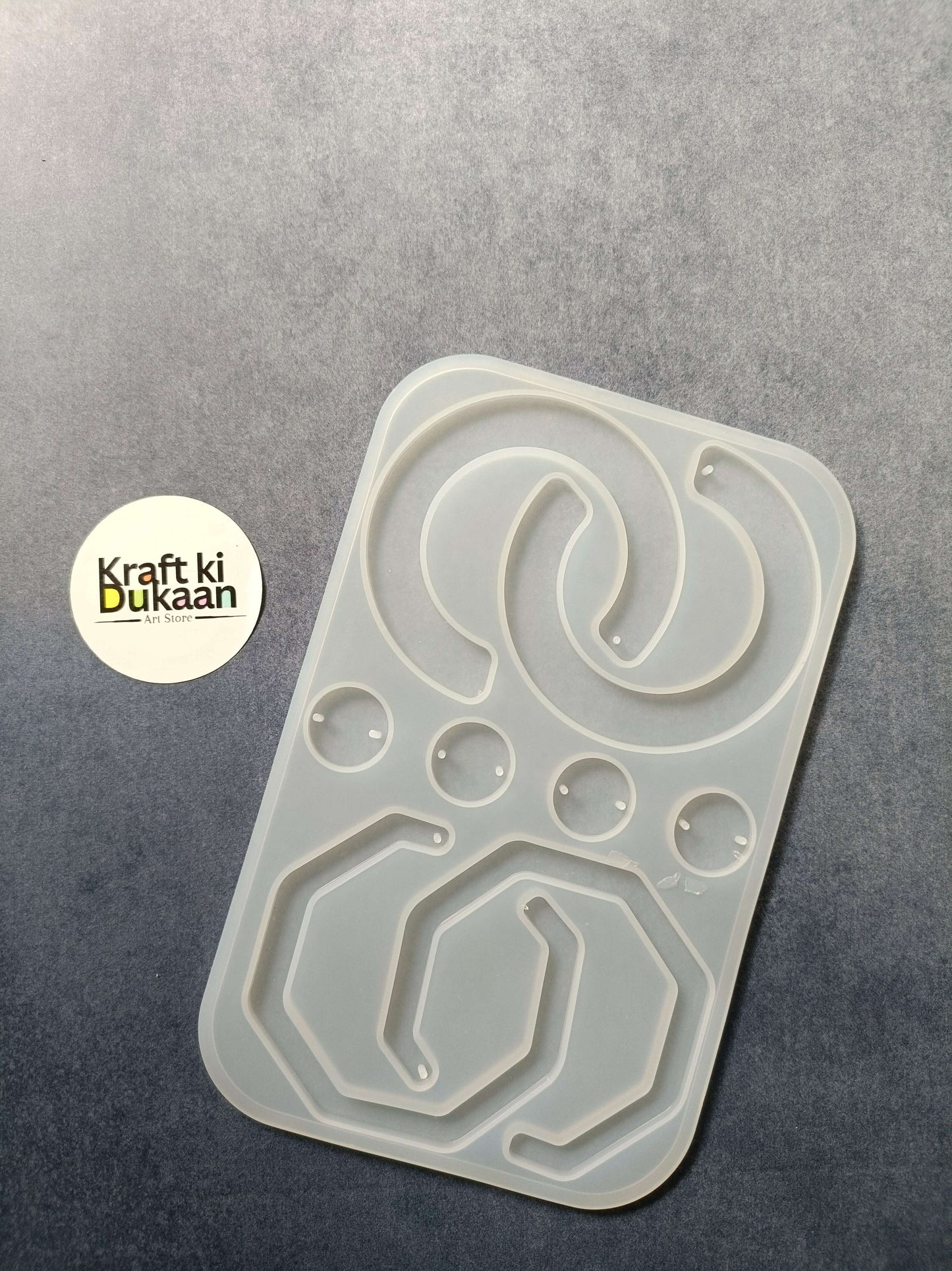 8-cavity silicone jewelry mould with shaped resin cavities, including heart and oval designs