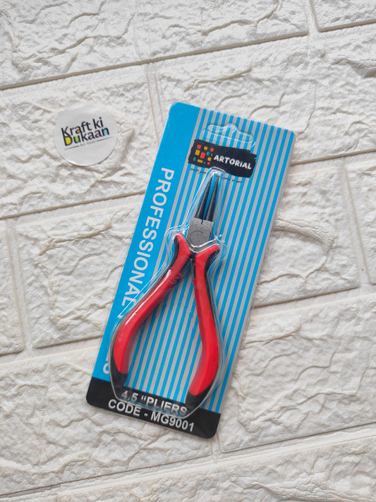 Red and black plier tool with needle nose tips in retail blister package