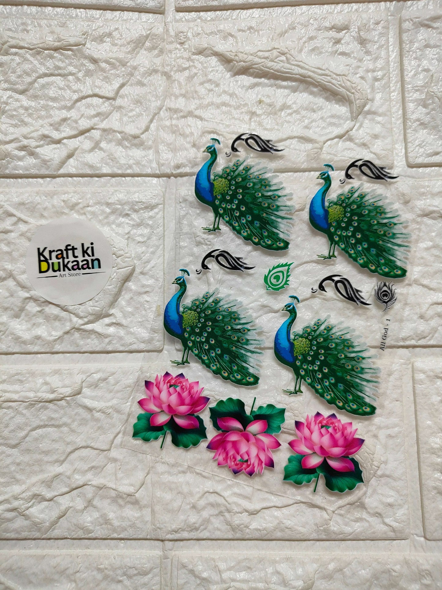 UV DTF peel-off sticker sheet with peacock feathers and pink lotus flowers