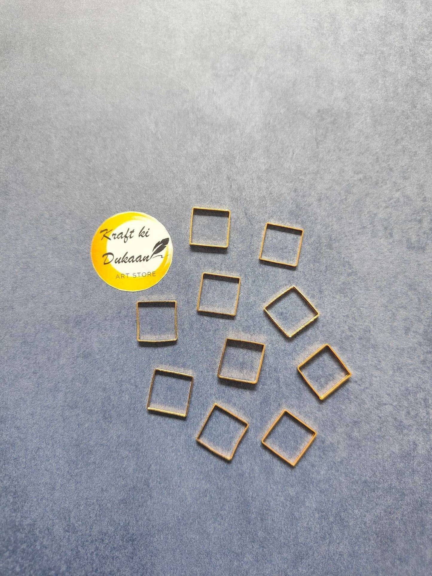 Square bezel 10PC: gold-tone square bezels with blue-toned centers, separate pieces