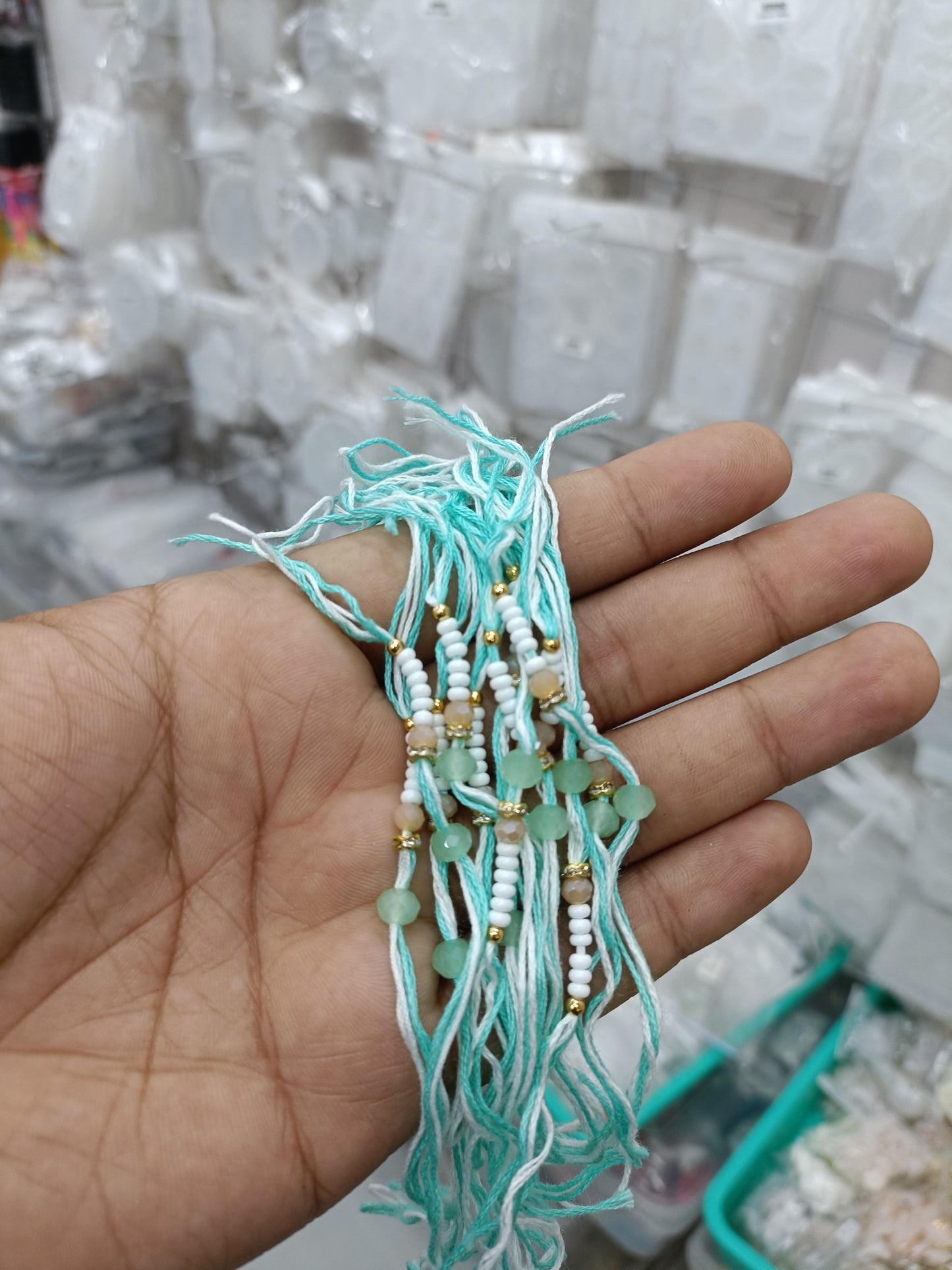 Rakhi cord pack of 12 pairs D13: turquoise braided threads with pearl-like beads