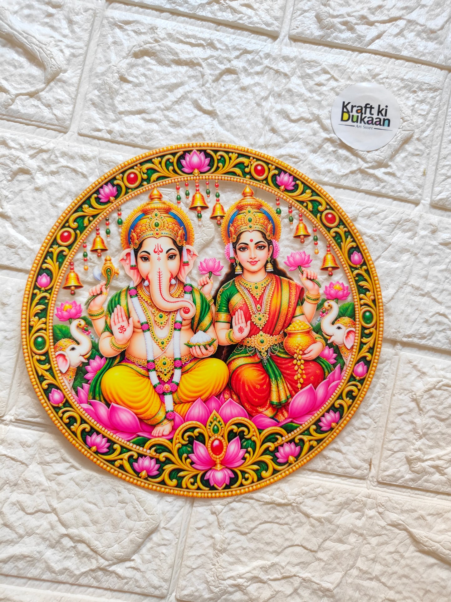 Round peel-off sticker with ornate Ganesha and Lakshmi figures in bright gold border
