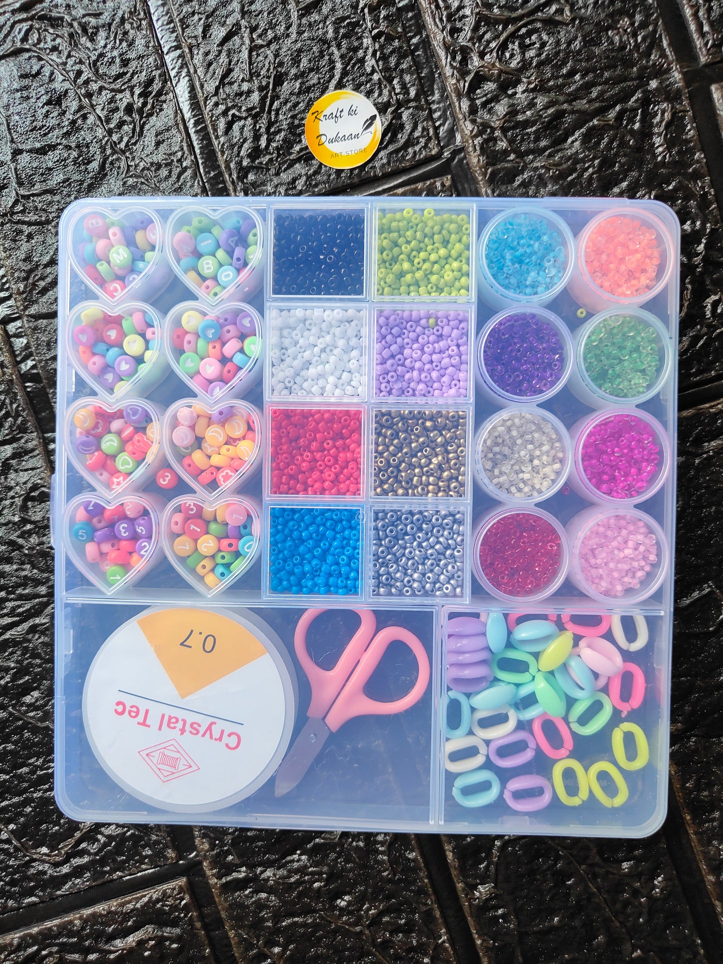 DIY bracelet beads kit in organizer tray with heart beads, round beads, glitter colors