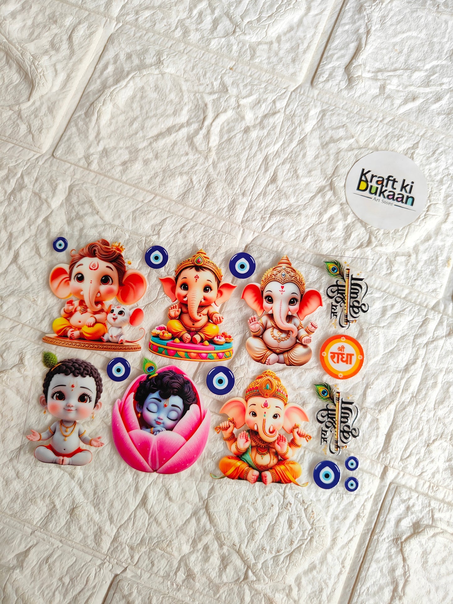 Peel-off UV DTF sticker sheet with colorful Ganesha and deity faces