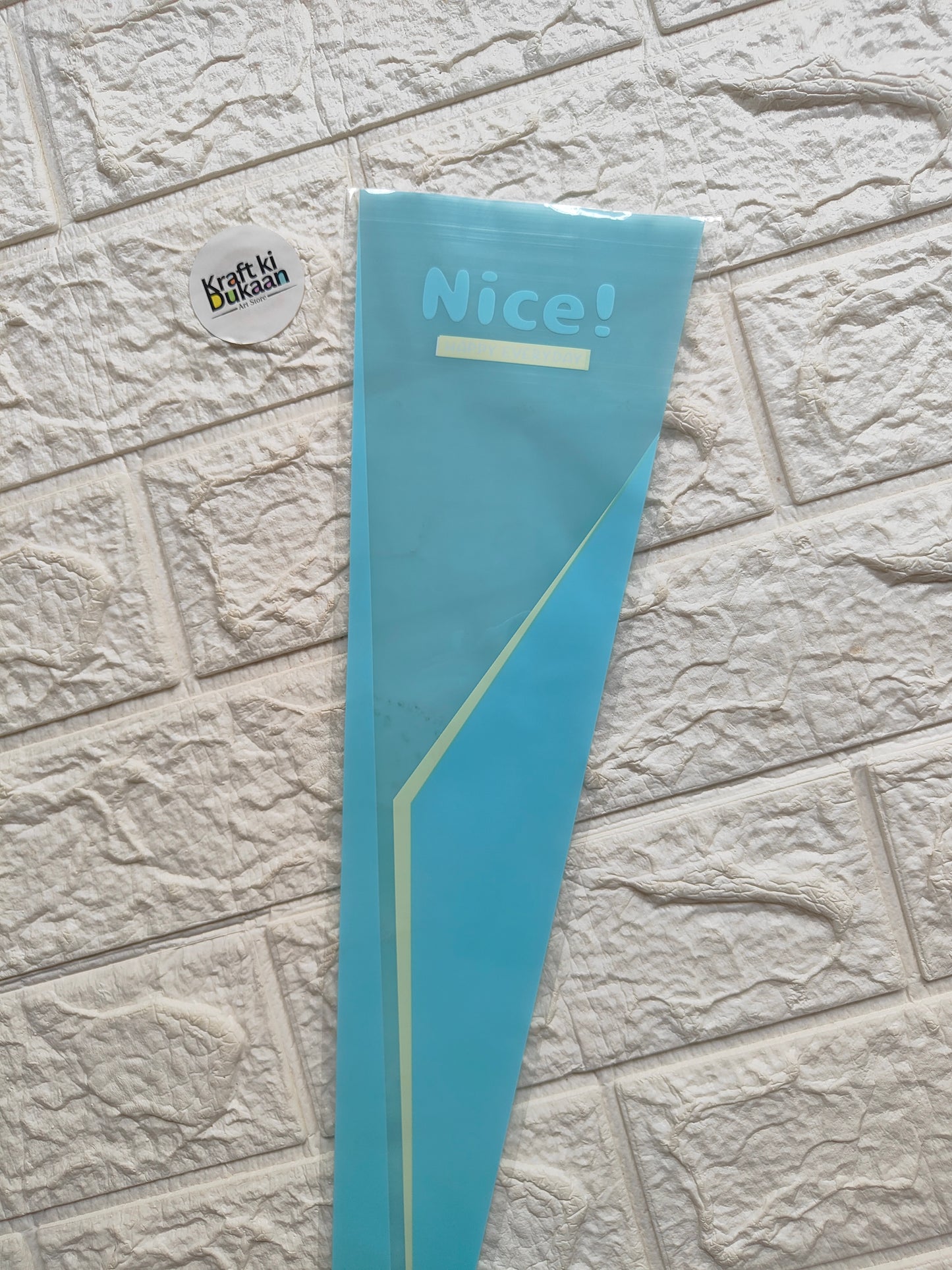 Flower cover sleeve, teal blue with “Nice!” and neon yellow diagonal stripe accents