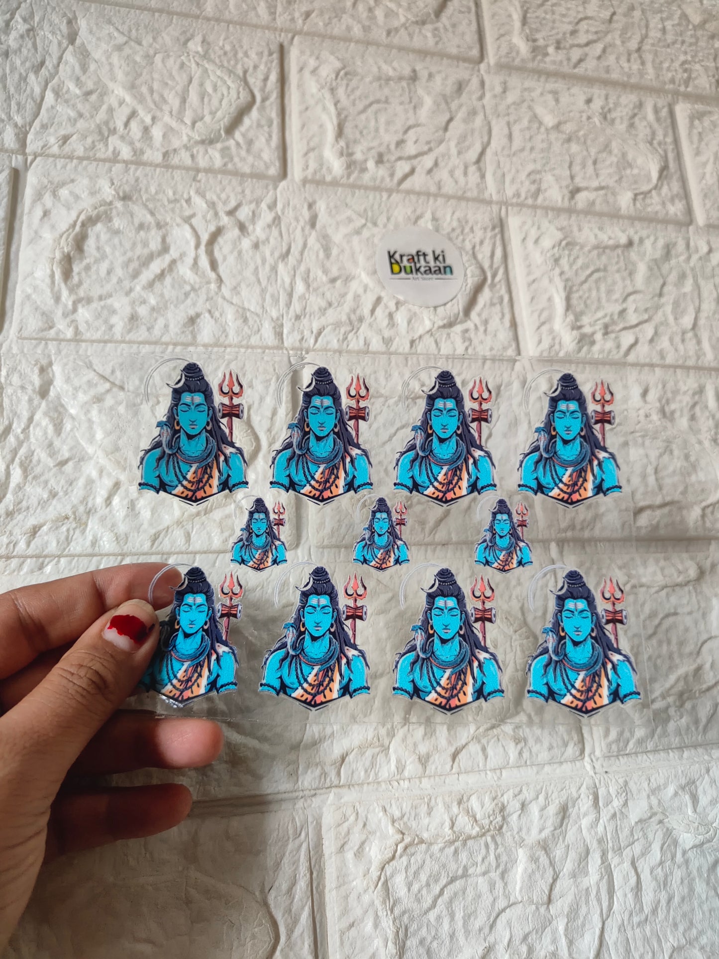 Peel-off sticker sheet with multiple blue deity figure decals