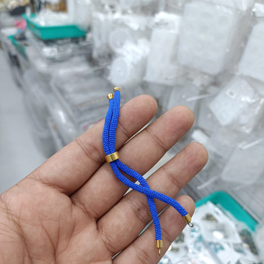 Blue braided Rakhi thread cord with gold end caps, tassel ties