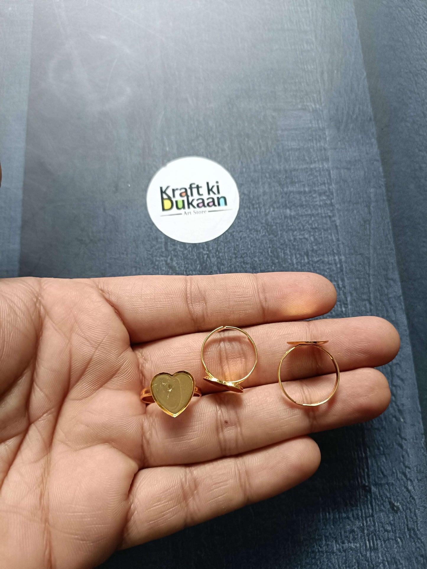 Gold ring base with heart-shaped top and round hoop