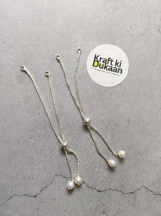 Silver-tone chain bracelet with pearl drop charms and small clasp