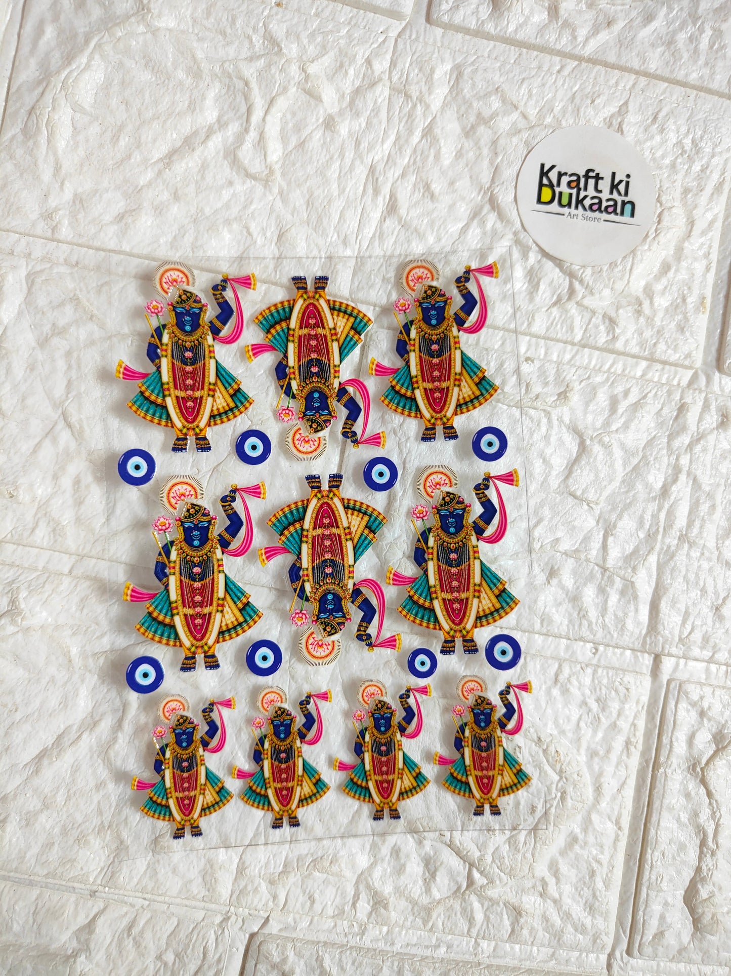 UV DTF peel-off sticker sheet with colorful blue-eye deity figures, small decorative pieces