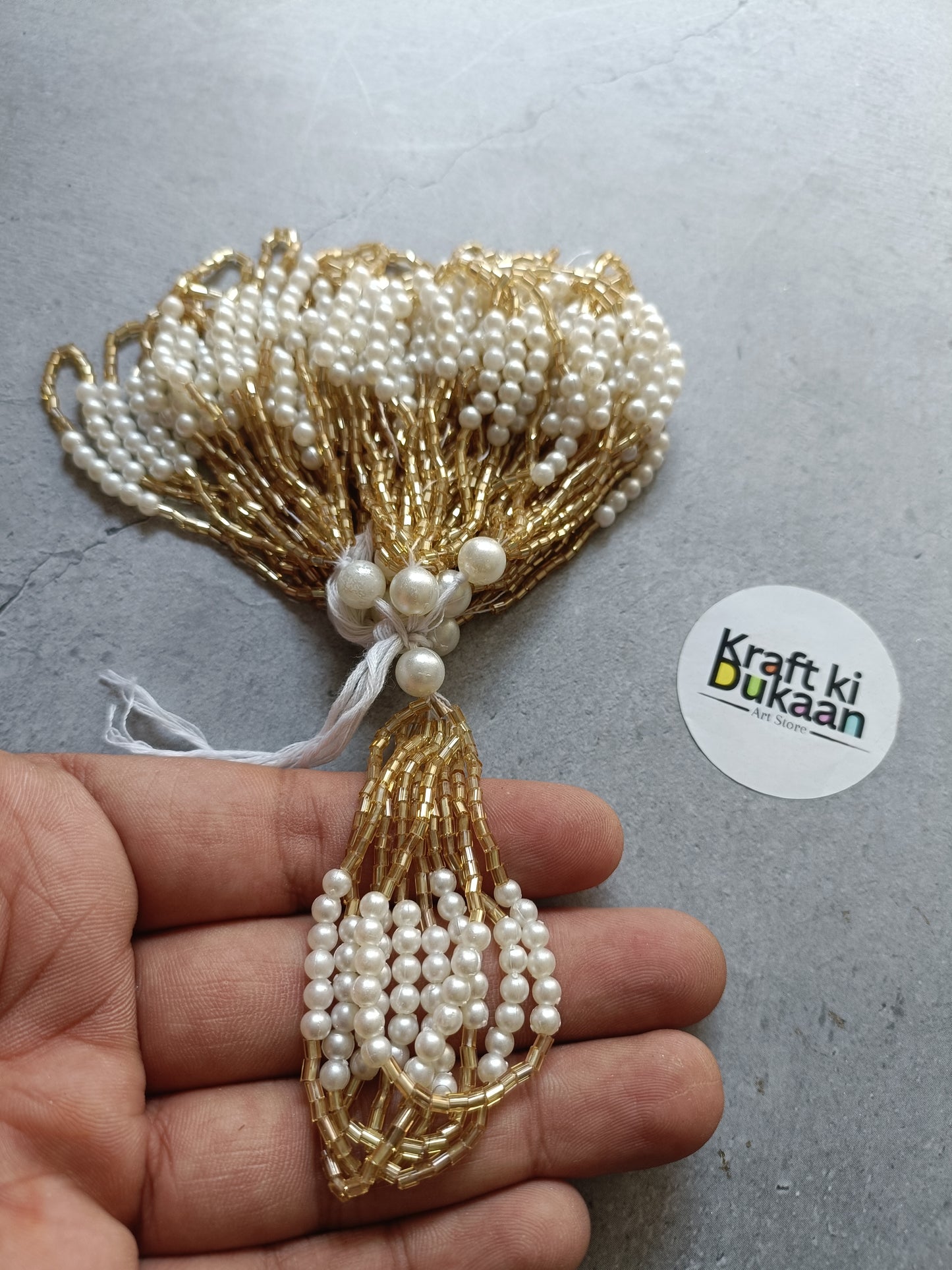 Gold and pearl decorative latkan tassel with beaded drops and braided threads