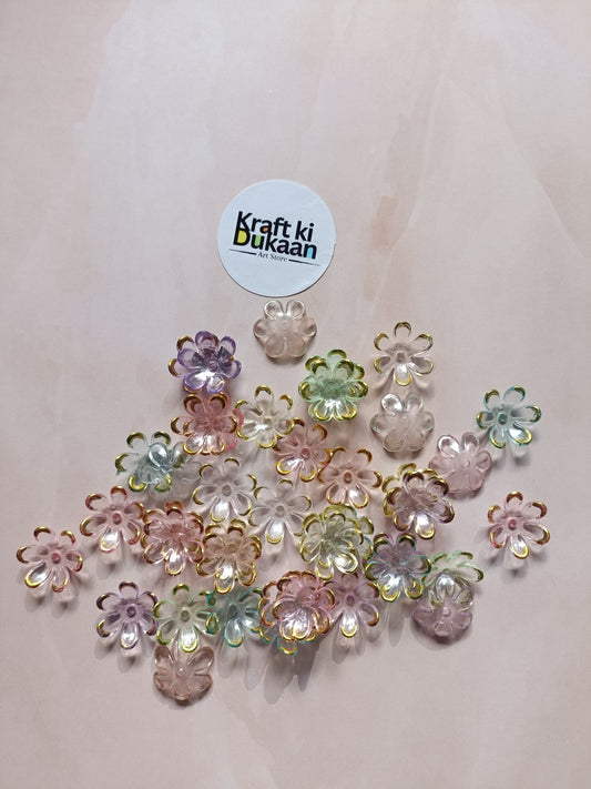 Multi-color flower beads scattered on surface