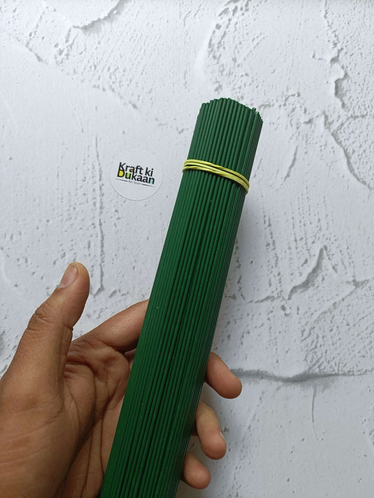Green plastic-coated wire sticks bundle, tied with rubber band