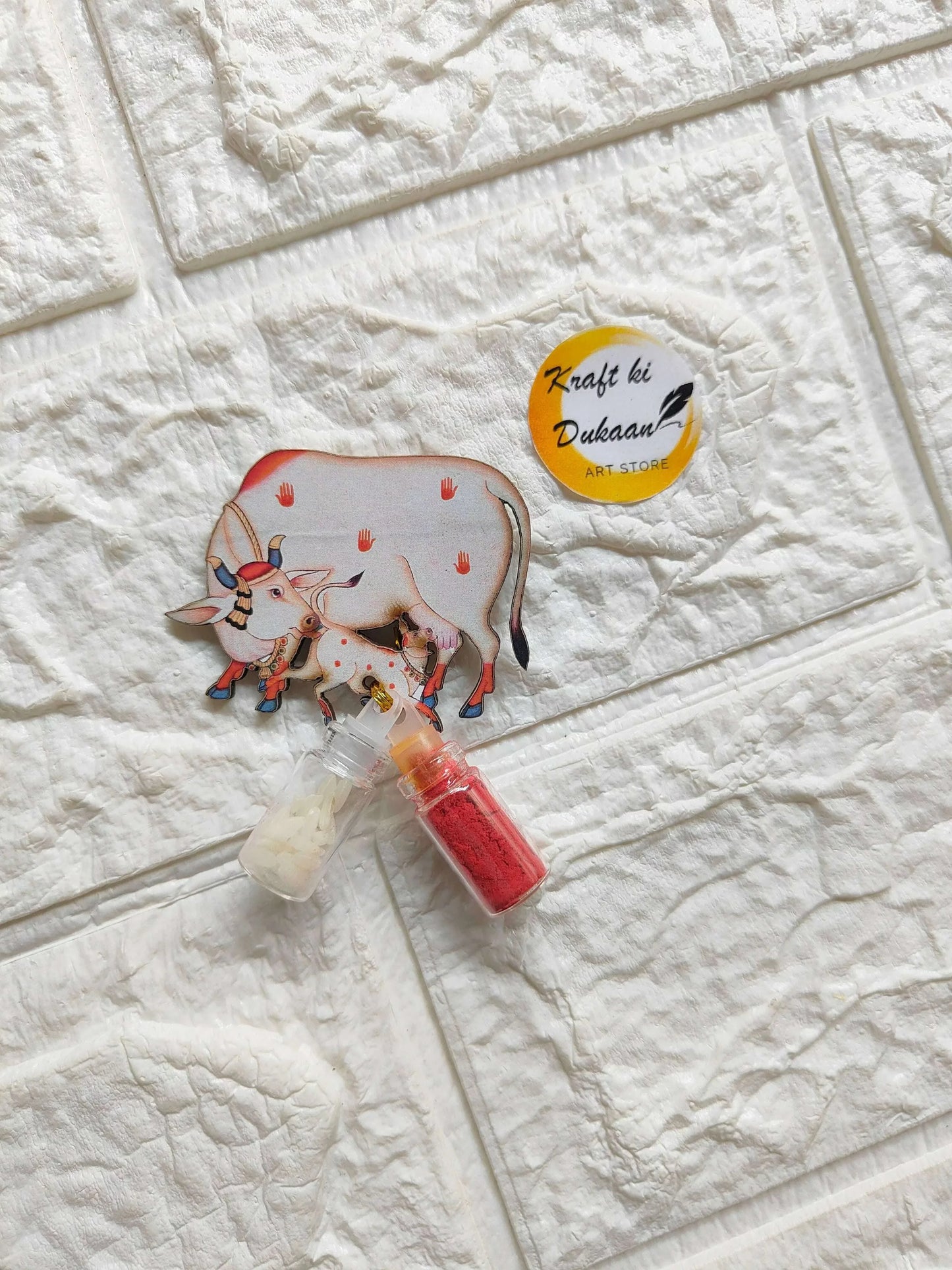 Roli Chawal bottle set A5: cow motif pouch with red and white mini bottles